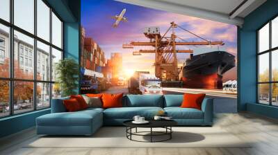 Container truck in ship port for business Logistics and transportation of Container Cargo ship and Cargo plane with working crane bridge in shipyard at sunrise, logistic import export and transport  Wall mural