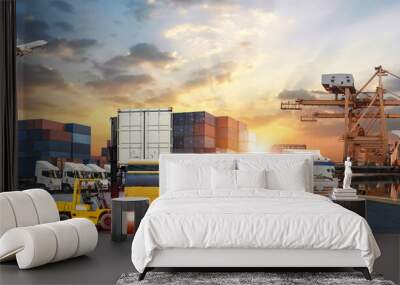 Container truck in ship port for business Logistics and transportation of Container Cargo ship and Cargo plane with working crane bridge in shipyard at sunrise, logistic import export concept Wall mural