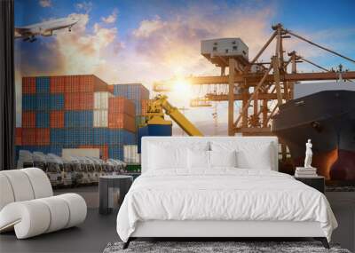 Logistics and transportation of Container Cargo ship and Cargo plane with working crane bridge in shipyard at sunrise, logistic import export and transport industry background Wall mural