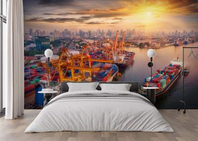 Logistics and transportation of Container Cargo ship and Cargo plane with working crane bridge in shipyard at sunrise, logistic import export and transport industry background Wall mural