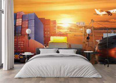 Logistics and transportation of Container Cargo ship and Cargo plane with working crane bridge in shipyard at sunrise, logistic import export and transport industry background Wall mural