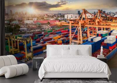 Logistics and transportation of Container Cargo ship and Cargo plane with working crane bridge in shipyard at twilight, logistic import export and transport industry background Wall mural