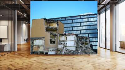 Office buildings demolition and crashing by machinery for new construction in Cracow, Krakow, Poland.     Wall mural