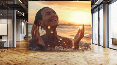 Happy middle aged woman enjoys refreshing swim in ocean at sunset, radiating joy and contentment in golden light, capturing serene pleasure of perfect moment Wall mural