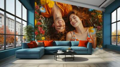 Joyful couple lying in vibrant wildflower field, smiling and enjoying beauty of nature and each other company, capturing essence of carefree happiness and romantic bliss Wall mural