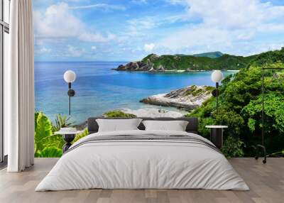 Tropical paradise of green hills, white sand, turquoise sea and deep blue sunny sky at Zamami, Okinawa, Japan Wall mural