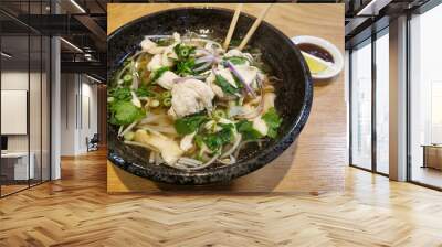 Pho Ga CHICKEN RAMEN Traditional Vietnamese noodle soup with herbs in a bowl with chopsticks Wall mural