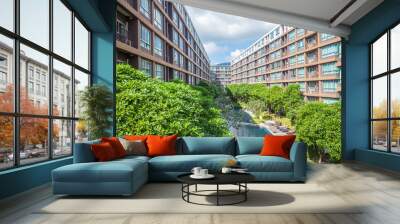 swimming pool with green trees among high rise modern condominium building with pool on phuket, thai Wall mural