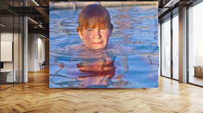 child has fun in the outdoor pool Wall mural