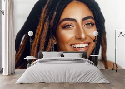 portrait of attractive smiling african woman with dreadlocks and colorful necklace isolated on white Wall mural