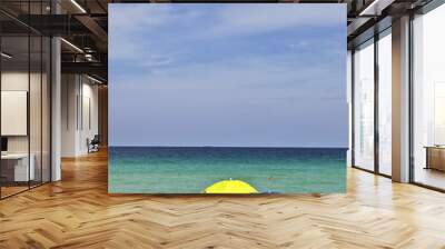 umbrella at the beautiful beach for sun protection Wall mural