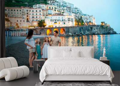 Adorable little girl on sunset in Amalfi town in Italy Wall mural