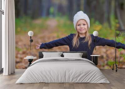 Adorable little girl outdoors at beautiful autumn day Wall mural