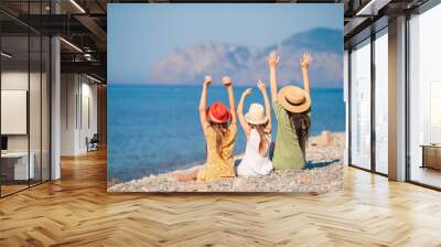 Adorable little girls and young mother on tropical white beach Wall mural