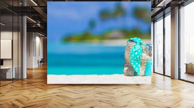 Beach accessories with Santa Hat on white tropical beach Wall mural