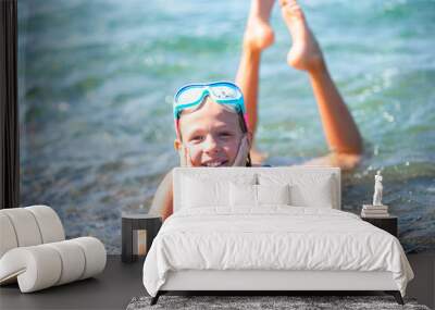 Cute little girl at beach during summer vacation Wall mural