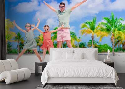 Father and kids enjoying beach summer vacation Wall mural