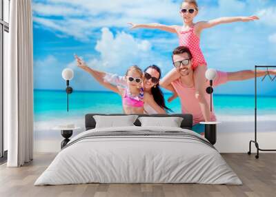 Happy beautiful family on the beach Wall mural