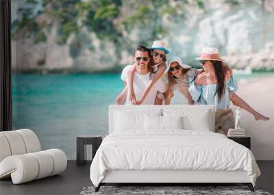 Happy beautiful family with kids on the beach Wall mural