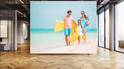 Happy beautiful family with kids on the beach Wall mural