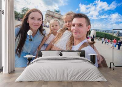 Happy family with two kids in Paris on summer vacation Wall mural