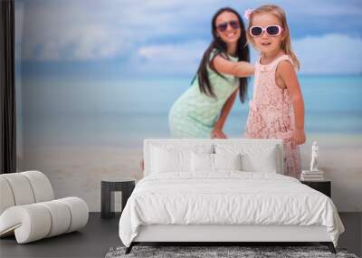 Little girl and happy mom during summer vacation Wall mural