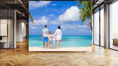 Parents with two kids enjoy their caribbean vacation on Antigua island Wall mural