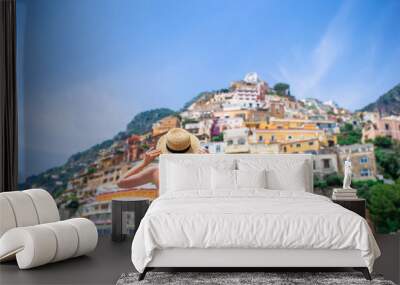 Summer holiday in Italy. Young woman in Positano village on the background, Amalfi Coast, Italy Wall mural