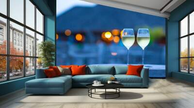 Two glasses of tasty white wine at sunset Wall mural