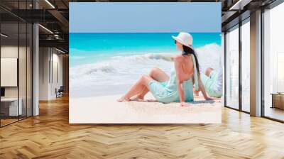 Young couple on white beach during summer vacation. Wall mural