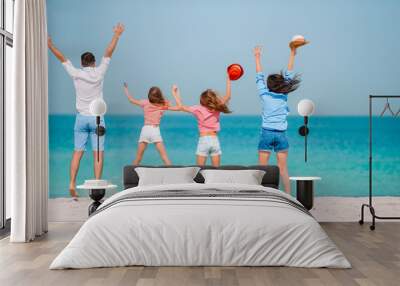 Young family on vacation have a lot of fun Wall mural