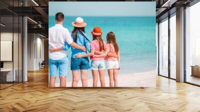 Young family on vacation have a lot of fun Wall mural