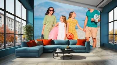 Young family on vacation have a lot of fun Wall mural