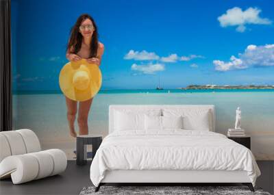 Young woman with hat on the beach enjoy caribbean vacation Wall mural