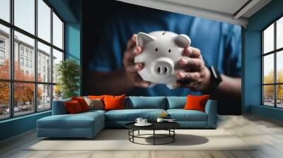 Happy  businessman saving money on a piggy bank Saving ideas and money
 Wall mural