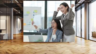 Two women in suits are celebrating a victory Wall mural