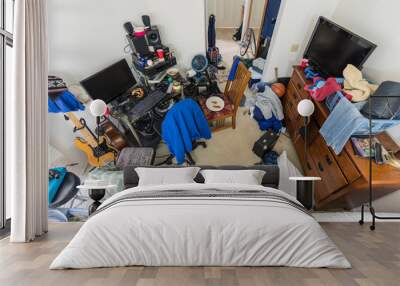 Very messy, cluttered suburban teenage boys bedroom with piles of clothes, music and sports equipment.   Wall mural