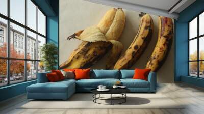 Twin Ripe plantain yellow in colour, ready to eat with skin half peeled. Twin Ethakka or plantain is rarely seen Wall mural