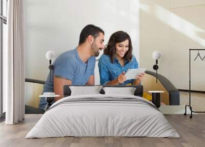 Couple using tablet Wall mural