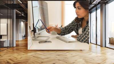 Woman picking colors for design Wall mural