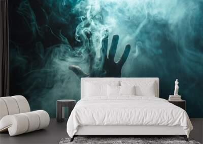 Human hand in the smoke, dark background Wall mural