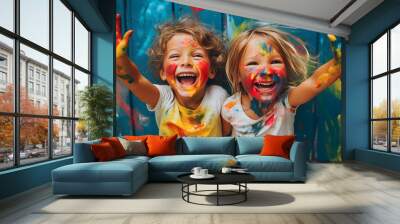 Kids laughing and having fun shows dirty hands with colorful paint Wall mural