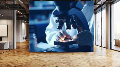 Scientist working with microscope in laboratory close up shot, science research and development Wall mural