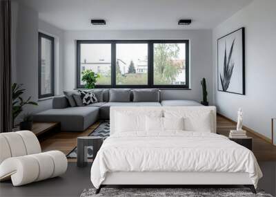 A mid-century modern interior photo of a living room with a wall hanging with an art frame and a gray-toned sofa and table. Generative AI
 Wall mural