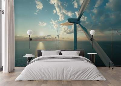 A wind turbine is seen in the distance over the ocean background Wall mural