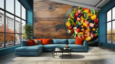 free space topview fruits salad in a glass bowl and ingredient healthy food concept on wooden background Wall mural