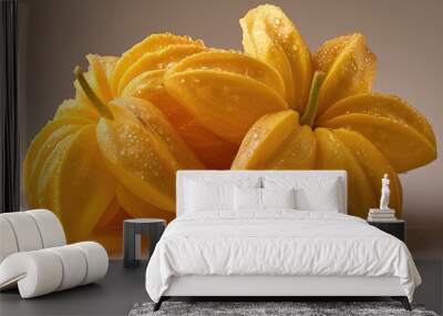 A macro shot of fresh yellow starfruit adorned with dew water on a green background Wall mural