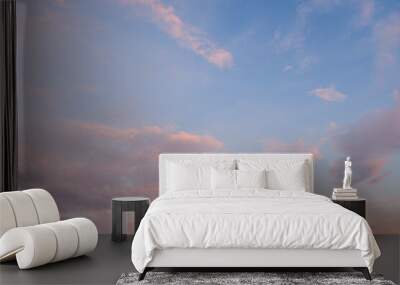 The sky at sunset before bad weather. Low red sunlight illuminates thunderclouds. Wall mural