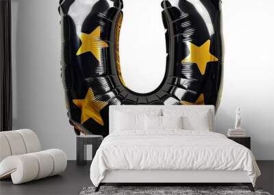 A black and gold star balloon in the shape of the letter Wall mural