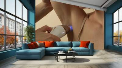 Armpit zone laser epilation treatment. Skin care, beauty and permanent hair removal concept. Wall mural